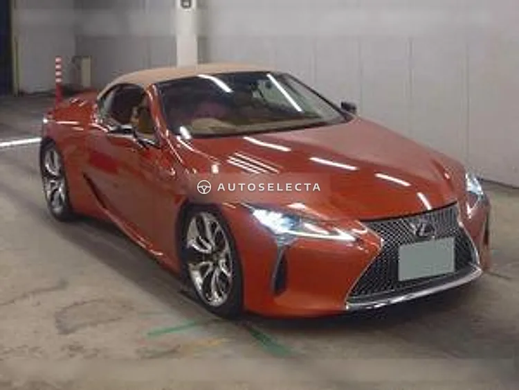 Orange 2021 Lexus LC500 Convertible front three quarter view from the right with tan roof